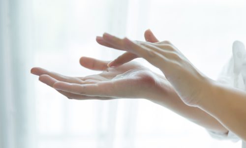 woman-holds-a-jar-with-a-cosmetic-cream-in-her-hands